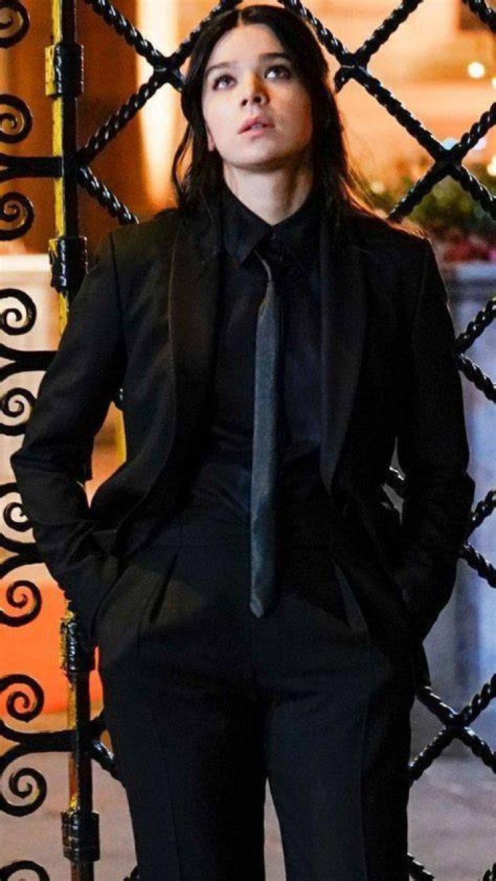 Why is Kate Bishop wearing a suit?
